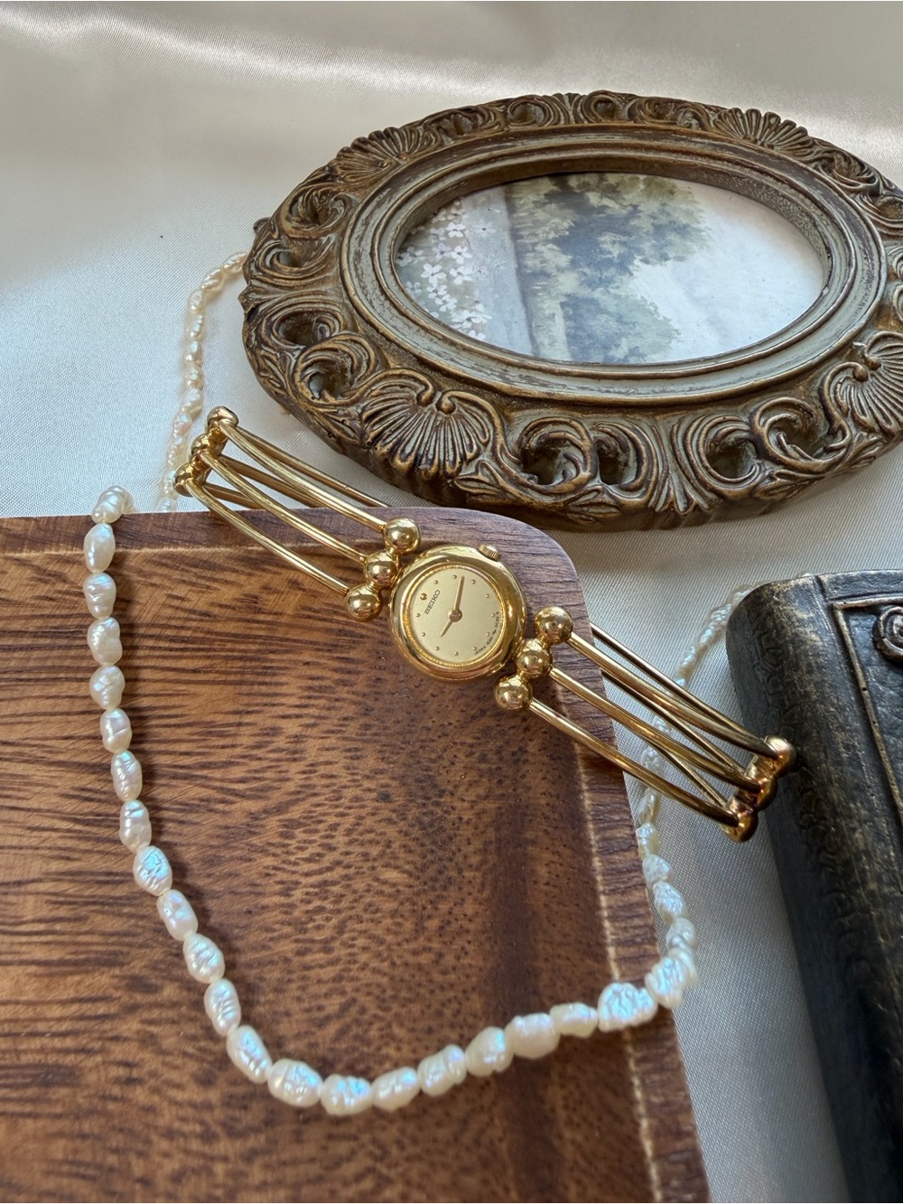 Seiko Gold-Tone Women's Bangle Watch with Super Mini Dial